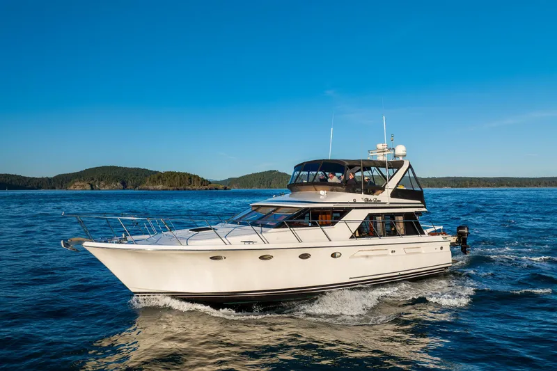 Slide: The Image of Ocean Alexander 48 Sedan yacht cruising on blue waters, 1990 model. - 7