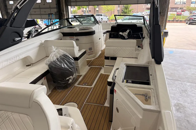 Slide: The Image of Interior view of 2026 Searay 290 SDX boat with luxurious seating and modern amenities. - 13