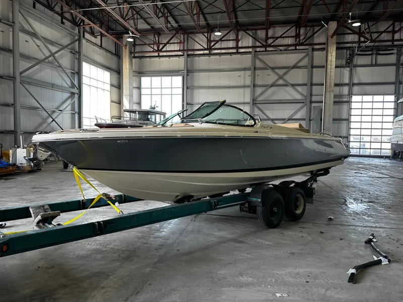 The Image of 2024 Chris-Craft 25 GT boat in warehouse on trailer. - 0