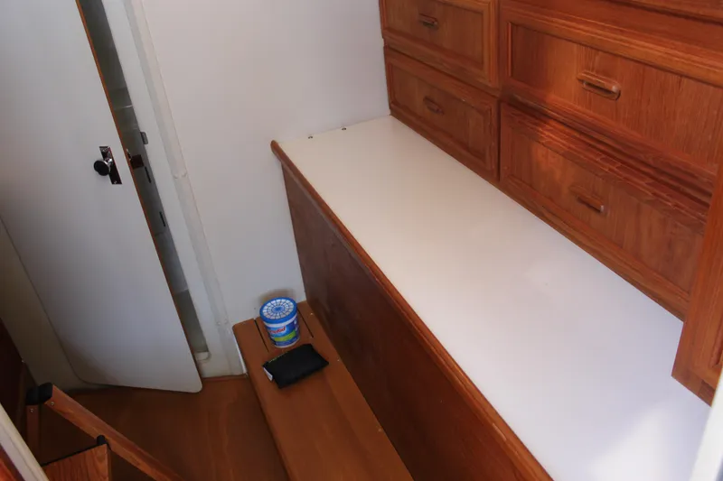 Slide: The Image of Interior of 1990 Carver 3207 Aft Cabin Motor Yacht with wooden cabinetry. - 15