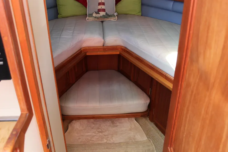 Slide: The Image of Cozy cabin interior of 1990 Carver 3207 Aft Cabin Motor Yacht with bedding and cushions. - 20