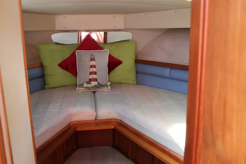 Slide: The Image of Cozy cabin interior of 1990 Carver 3207 Aft Cabin Motor Yacht with decorative pillows. - 21