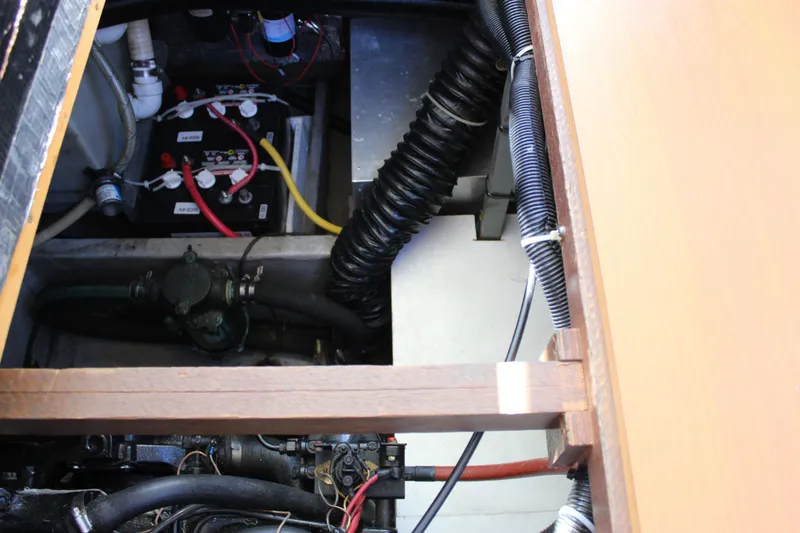 Slide: The Image of Engine compartment of a 1990 Carver 3207 Aft Cabin Motor Yacht, showing batteries and wiring. - 28