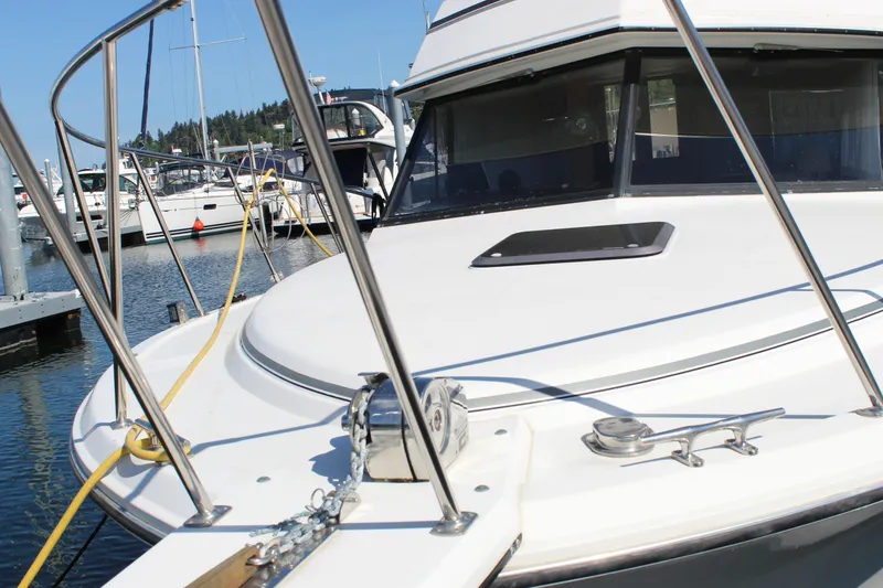 Slide: The Image of 1990 Carver 3207 Aft Cabin Motor Yacht docked at marina, sunny day. - 7