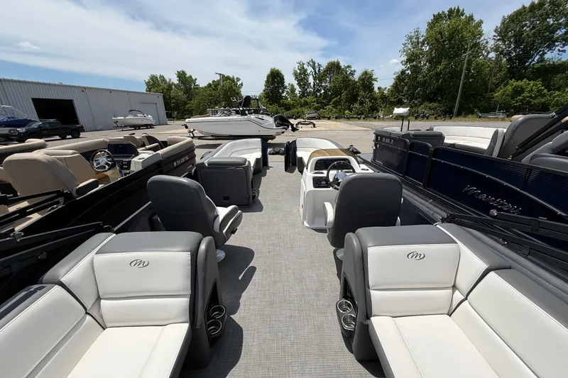 Slide: The Image of 2022 Manitou Aurora LE pontoon boat with spacious seating and modern design. - 3