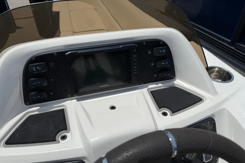 Slide: The Image of 2022 Manitou Aurora LE dashboard with Garmin display and control buttons. - 4