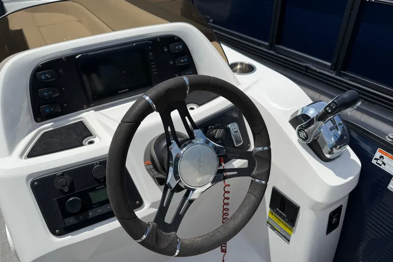 Slide: The Image of Steering console of 2022 Manitou Aurora LE boat with modern controls and dashboard. - 5