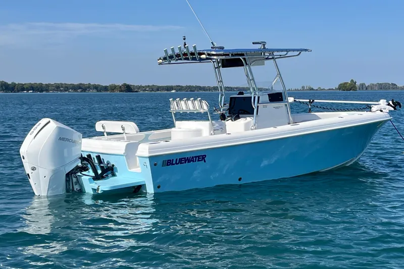 The Image of 2023 Bluewater Sportfishing 23t boat on calm blue water, featuring a sleek design. - 1