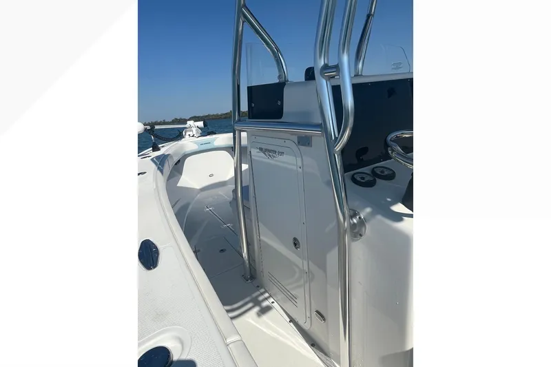 Slide: The Image of 2023 Bluewater Sportfishing 23t boat interior with sleek design and stainless steel features. - 13