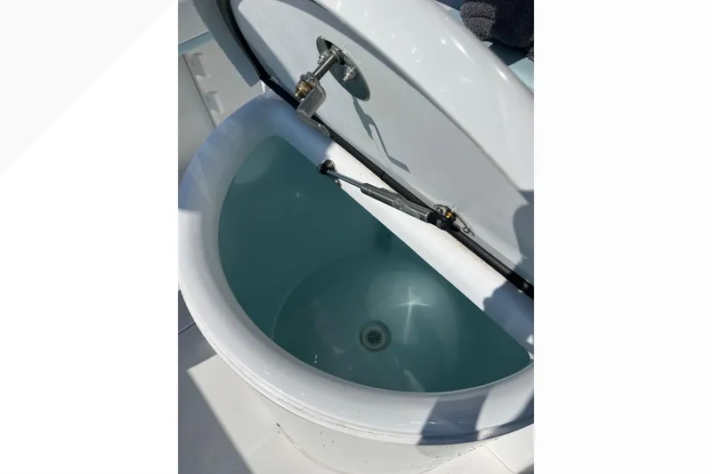 Slide: The Image of Open livewell on 2023 Bluewater Sportfishing 23t boat, showcasing interior design. - 22