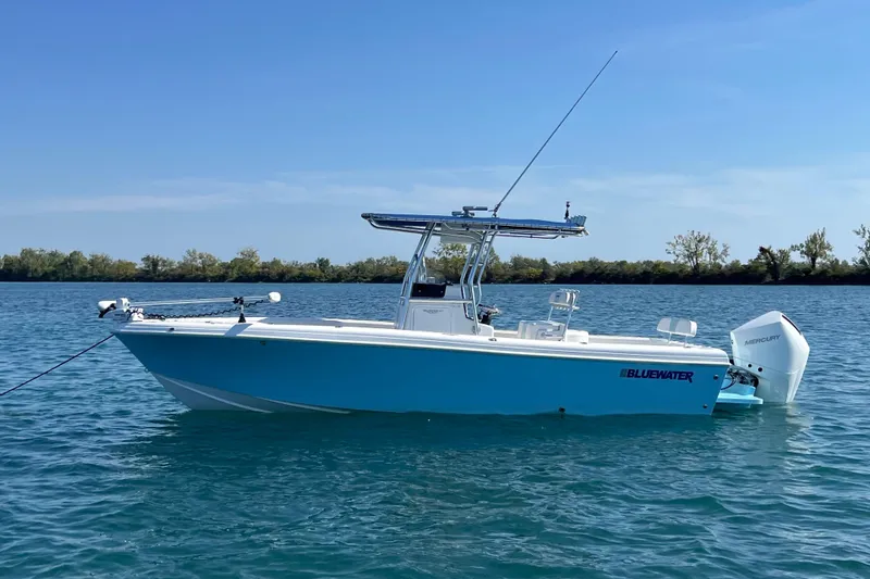 Slide: The Image of 2023 Bluewater Sportfishing 23t boat on calm water, clear sky background. - 3