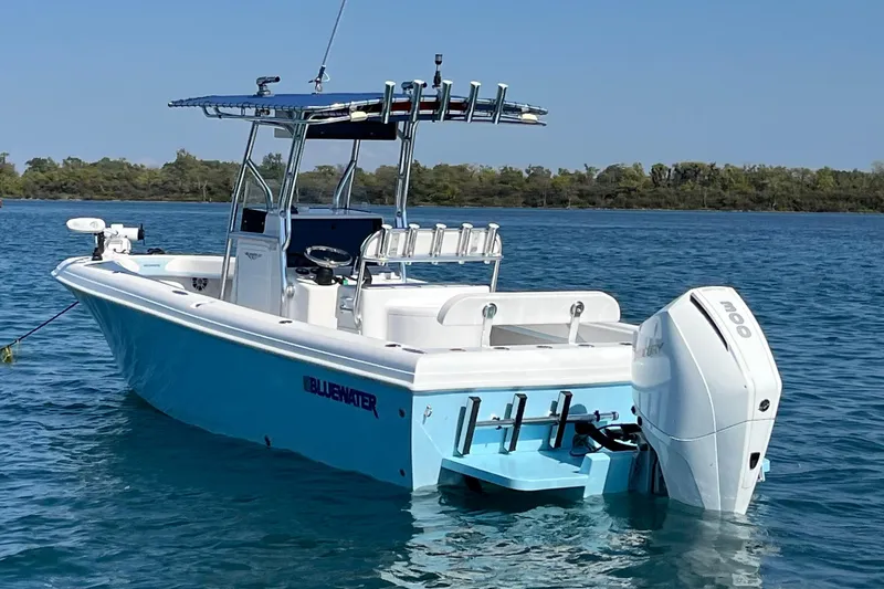 Slide: The Image of 2023 Bluewater Sportfishing 23t boat on calm water, featuring a sleek design and powerful engine. - 4