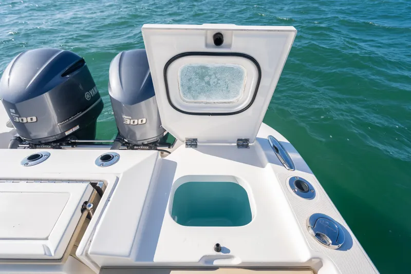 Slide: The Image of 2018 Pursuit S 328 Sport boat with Yamaha 300 engines on open water. - 15