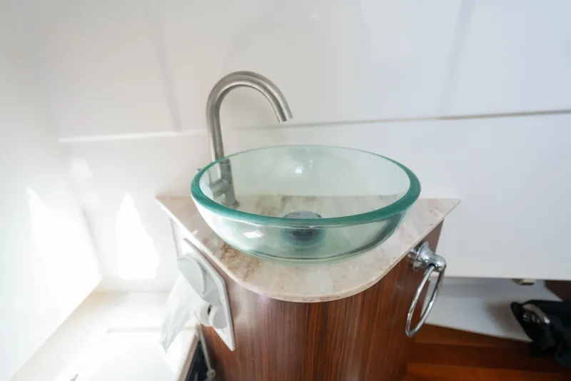 Slide: The Image of Glass vessel sink in 2018 Pursuit S 328 Sport boat bathroom. - 19
