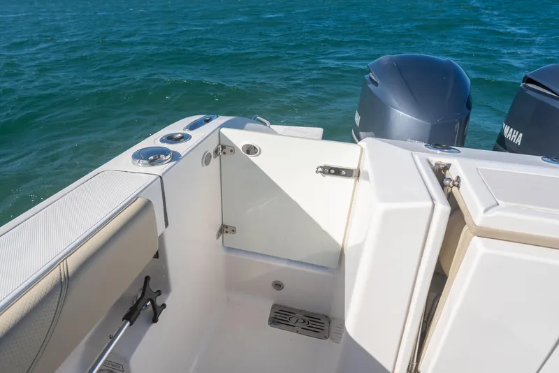 Slide: The Image of 2018 Pursuit S 328 Sport boat with Yamaha engines on open water. - 23