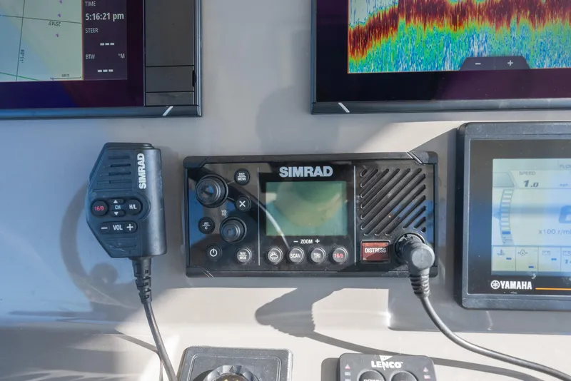 Slide: The Image of Simrad marine electronics on 2018 Pursuit S 328 Sport boat dashboard, featuring navigation and communication systems. - 36