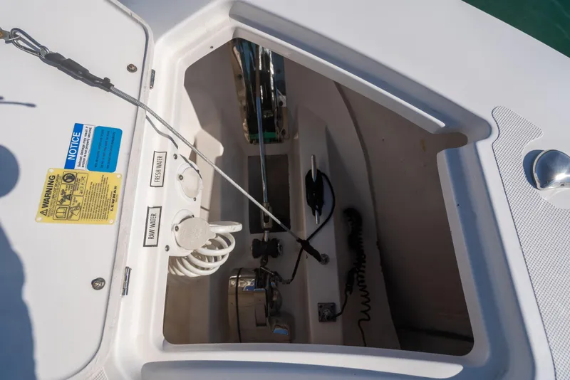 Slide: The Image of 2018 Pursuit S 328 Sport boat compartment with fresh and raw water access. - 45