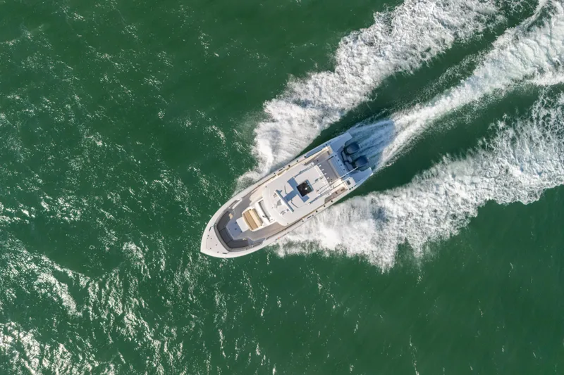 Slide: The Image of Aerial view of 2018 Pursuit S 328 Sport boat cruising on open water. - 7