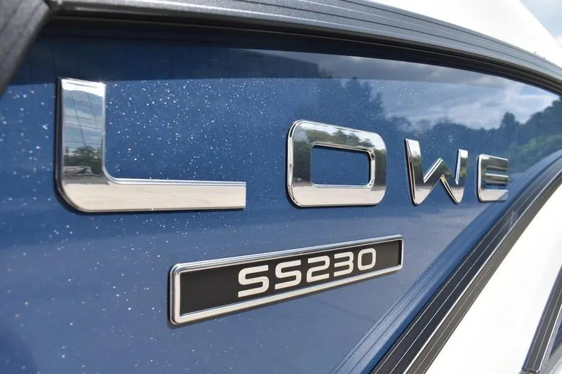 Slide: The Image of Close-up of 2026 Lowe SS 230 WT Special boat logo on blue surface. - 10
