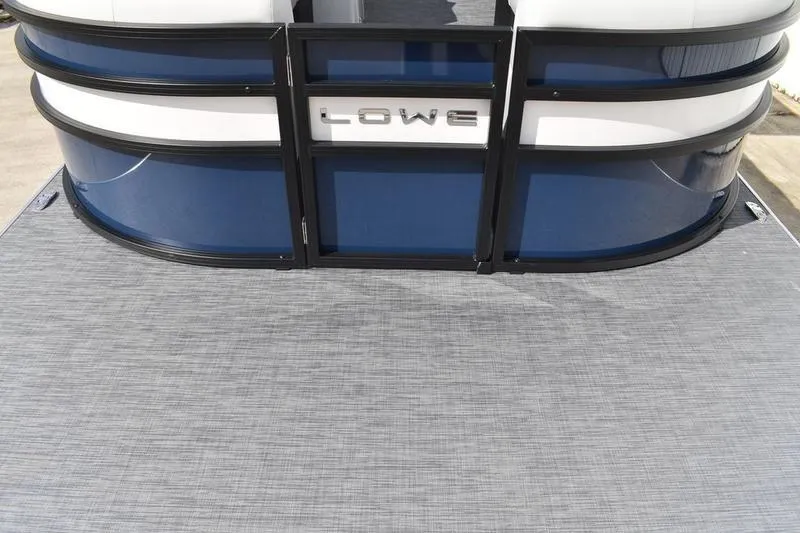 Slide: The Image of 2026 Lowe SS 230 WT Special pontoon boat with sleek blue and white design. - 12
