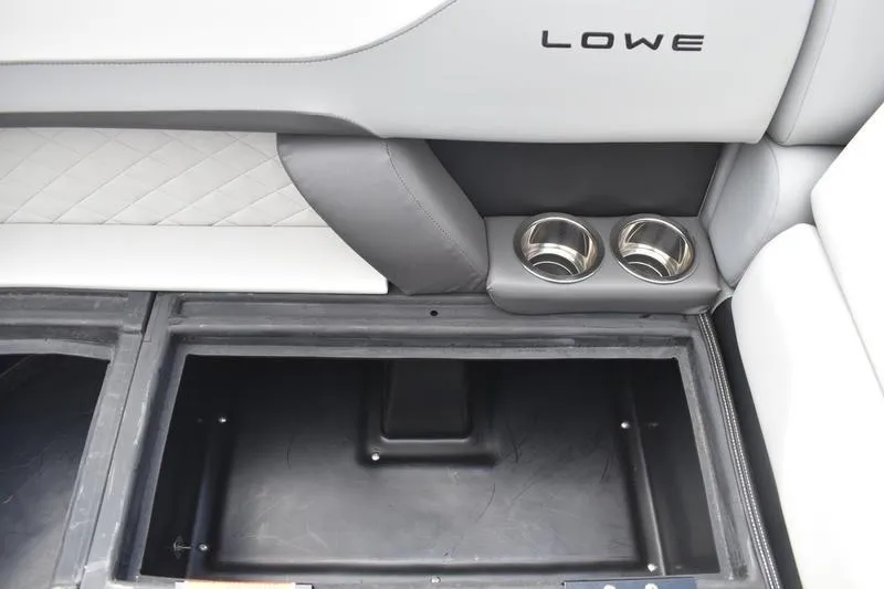 Slide: The Image of Interior of 2026 Lowe SS 230 WT Special boat with cup holders and storage compartment. - 14
