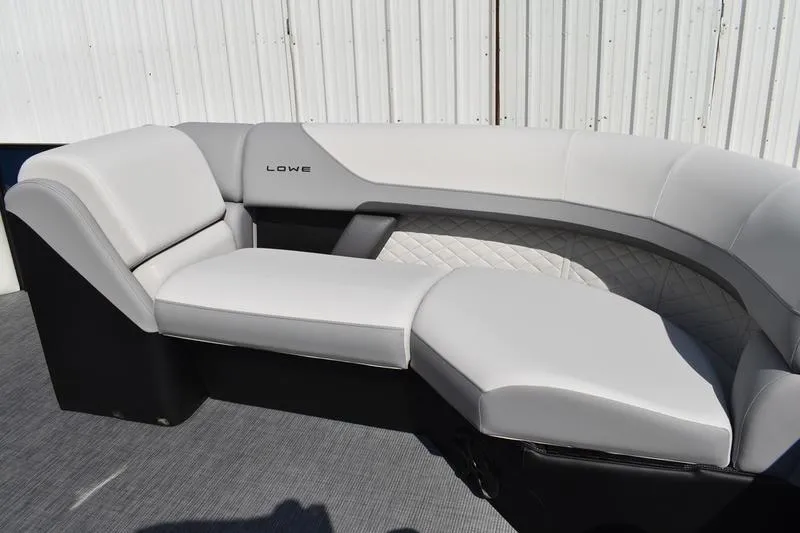 Slide: The Image of Luxurious seating on 2026 Lowe SS 230 WT Special boat, featuring elegant white upholstery. - 20