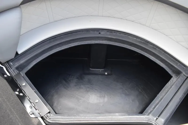 Slide: The Image of Storage compartment in 2026 Lowe SS 230 WT Special boat, featuring quilted interior design. - 22