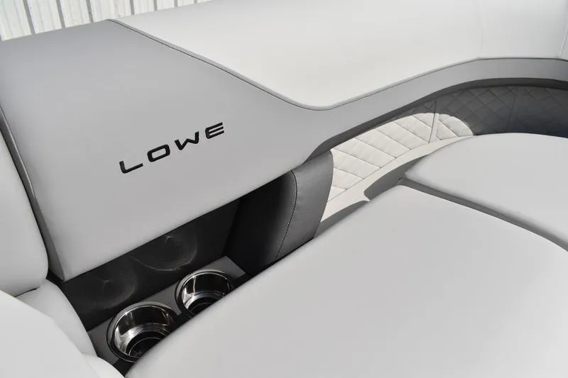 Slide: The Image of 2026 Lowe SS 230 WT Special boat interior with sleek white seating and cup holders. - 24