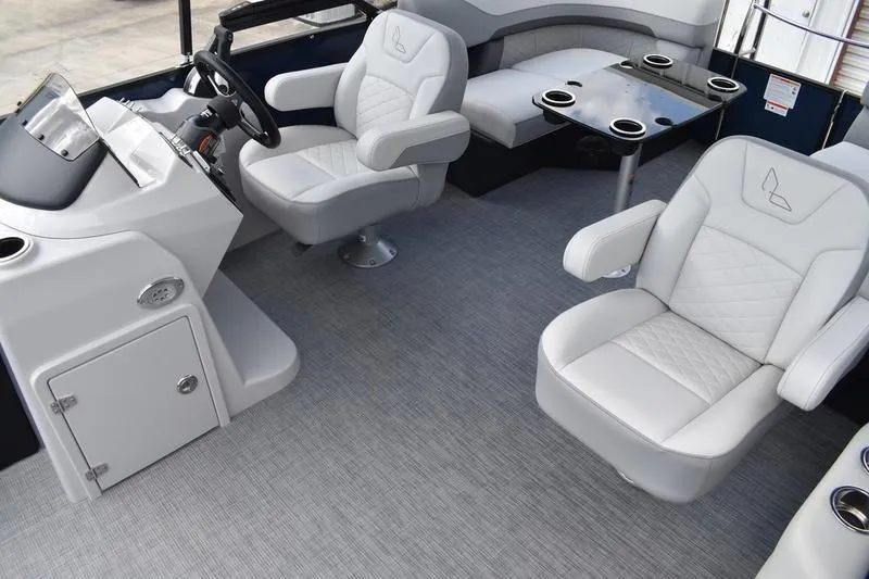Slide: The Image of 2026 Lowe SS 230 WT Special boat interior with plush seating and modern helm. - 25