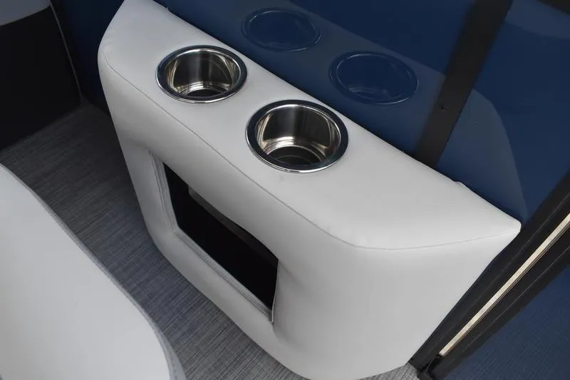 Slide: The Image of 2026 Lowe SS 230 WT Special boat interior with dual cup holders and storage compartment. - 27