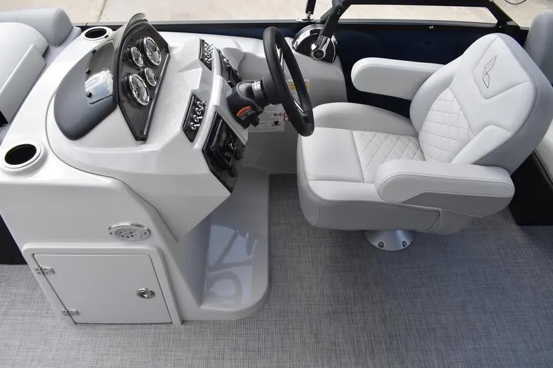 Slide: The Image of 2026 Lowe SS 230 WT Special boat interior with steering console and cushioned captain's chair. - 28