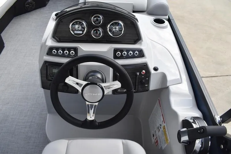 Slide: The Image of Steering console of 2026 Lowe SS 230 WT Special boat with modern controls and gauges. - 29