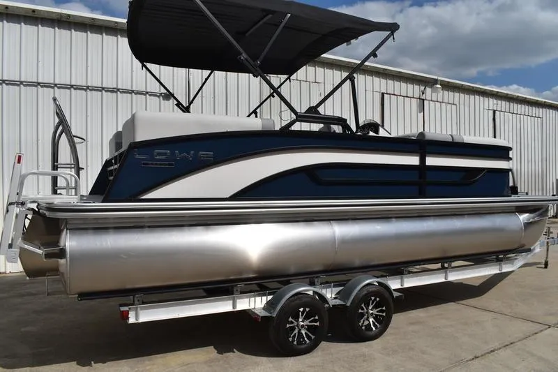 Slide: The Image of 2026 Lowe SS 230 WT Special pontoon boat on trailer, featuring sleek design and canopy. - 3