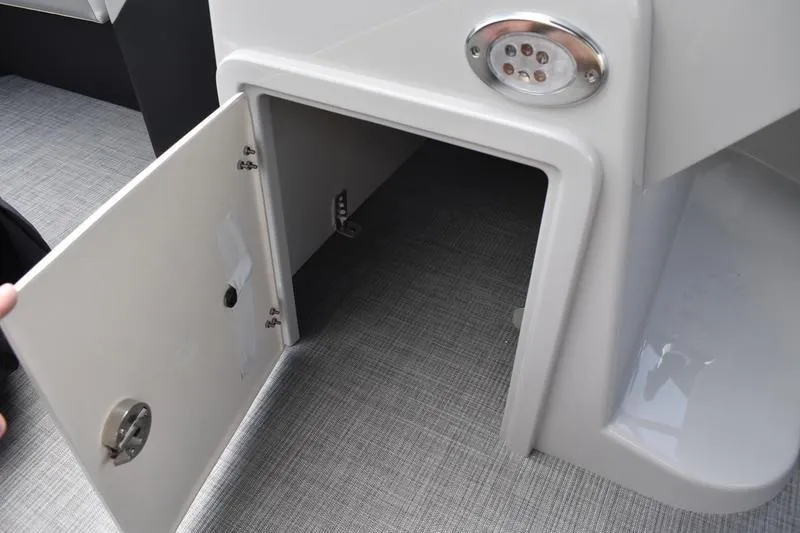Slide: The Image of Open storage compartment on 2026 Lowe SS 230 WT Special boat. - 31
