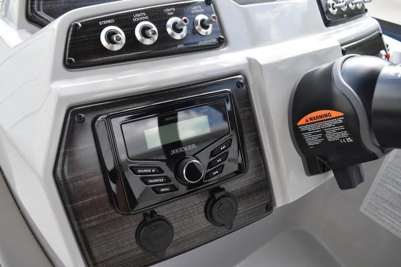 Slide: The Image of Control panel of 2026 Lowe SS 230 WT Special boat with stereo and switches. - 34