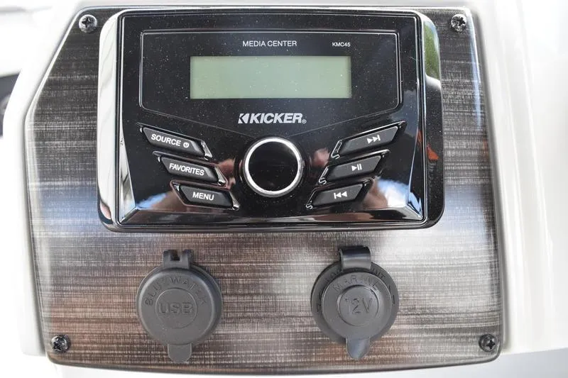 Slide: The Image of Kicker media center on 2026 Lowe SS 230 WT Special boat dashboard with USB and 12V ports. - 36