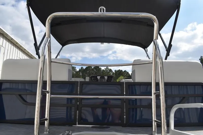 Slide: The Image of 2026 Lowe SS 230 WT Special pontoon boat with canopy and seating, viewed from the rear. - 4
