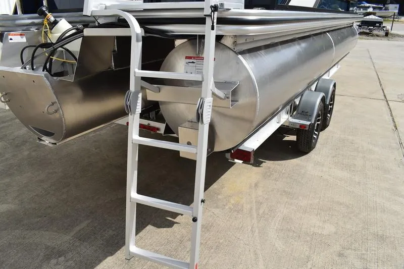 Slide: The Image of 2026 Lowe SS 230 WT Special pontoon boat with ladder and trailer. - 5