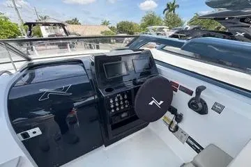 Slide: The Image of 2025 NX Boats NX290 Exclusive cockpit with modern controls and sleek design. - 4