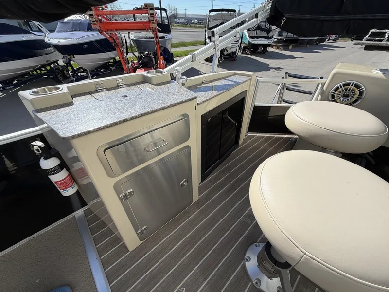 Slide: The Image of Interior of a 2014 Godfrey Aqua Patio CB 240 with seating area. - 12