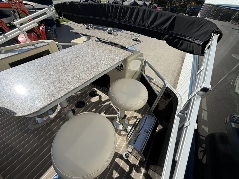 Slide: The Image of Interior of a 2014 Godfrey Aqua Patio CB 240 boat with bar area. - 13