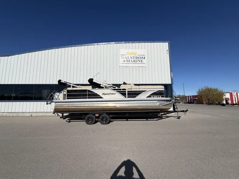 Slide: The Image of 2014 Godfrey Aqua Patio CB 240 in front of Walstrom Marine building. - 2