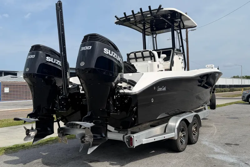 The Image of 2020 Sea Cat 260 boat with dual Suzuki 300 engines on a trailer. - 0