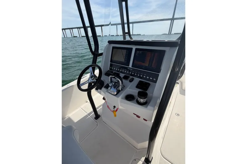 Slide: The Image of Helm of 2020 Sea Cat 260 boat with dual displays and steering wheel. - 10