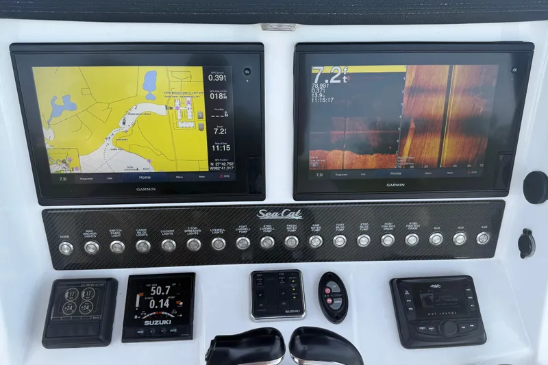 Slide: The Image of Control panel of a 2020 Sea Cat 260 boat with Garmin displays. - 11