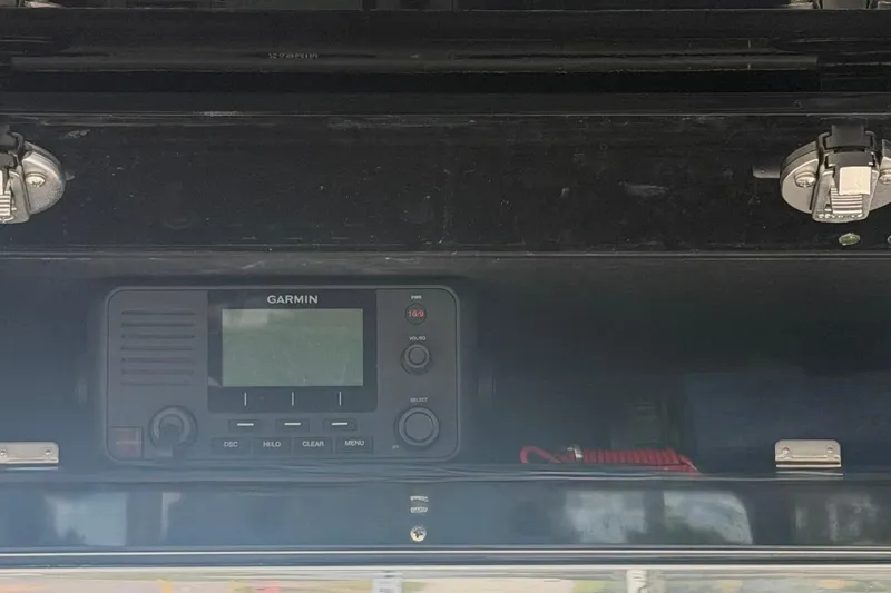 Slide: The Image of Garmin marine radio installed on a 2020 Sea Cat 260 boat dashboard. - 14