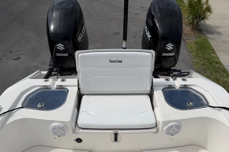 Slide: The Image of 2020 Sea Cat 260 boat with dual Suzuki 300 engines, rear seating, and live wells. - 19