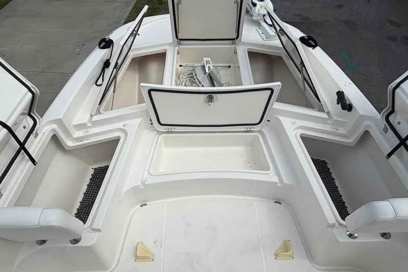 Slide: The Image of Open storage compartments on a 2020 Sea Cat 260 boat deck. - 22