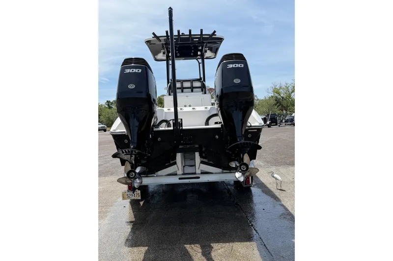Slide: The Image of Rear view of 2020 Sea Cat 260 boat with dual 300 horsepower engines. - 3
