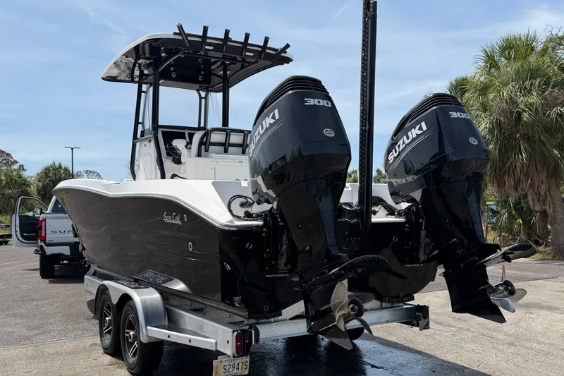 Slide: The Image of 2020 Sea Cat 260 boat with dual Suzuki 300 engines on a trailer. - 4